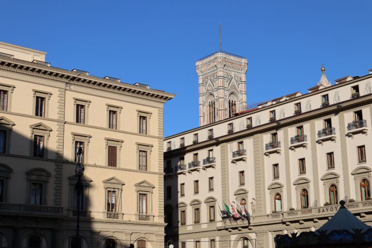 View of IAU Center building and Giotto's Bell Tower from Piazza della Repubblica